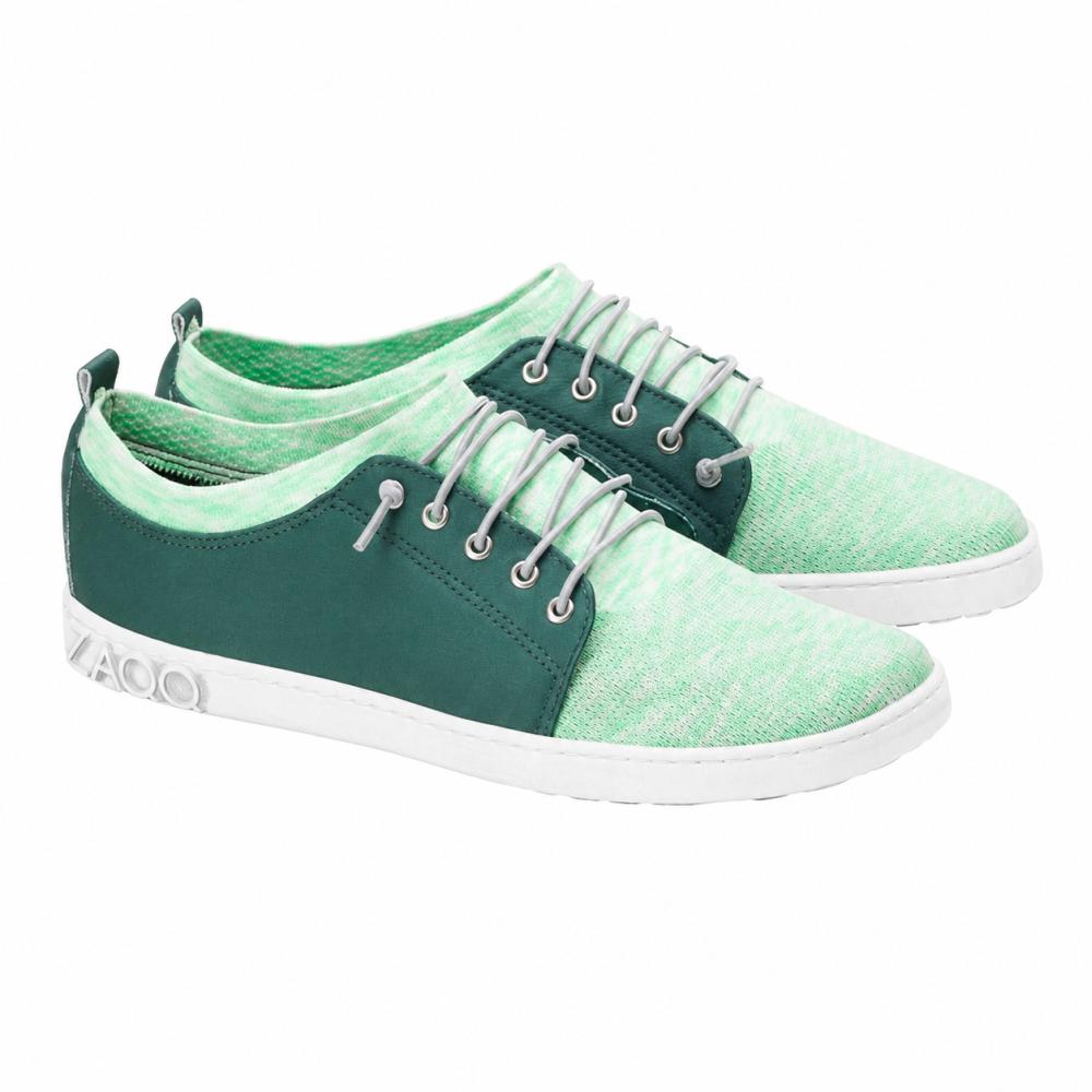 Vi presenterar QRIS Green Sneaker från ZAQQ: ett stilfullt par mintgröna fritidsskor med vit sula, mörkgröna accenter och vita skosnören. Dessa sneakers kännetecknas av en modern, sportig design och är perfekta för varje äventyr.